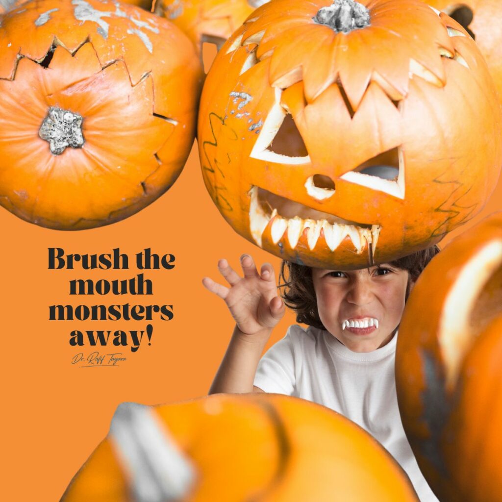 Child in vampire teeth behind carved pumpkins — brush the mouth monsters away, Halloween dental tips from a pediatric dentist in Dubai
