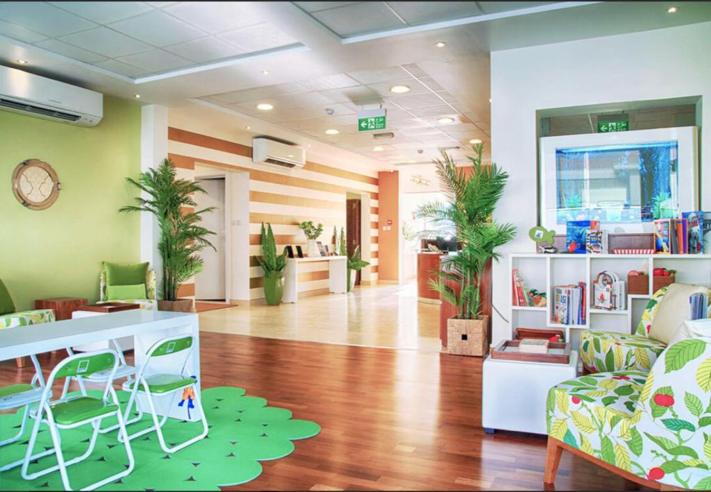 Bright, child-friendly waiting room of a pediatric dental clinic in Dubai