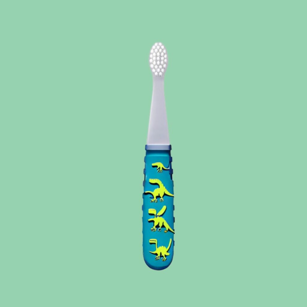 Kids toothbrush with a small head and dinosaur handle recommended by a pediatric dentist in Dubai